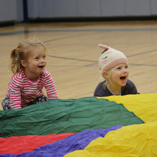 toddles playing with parachute